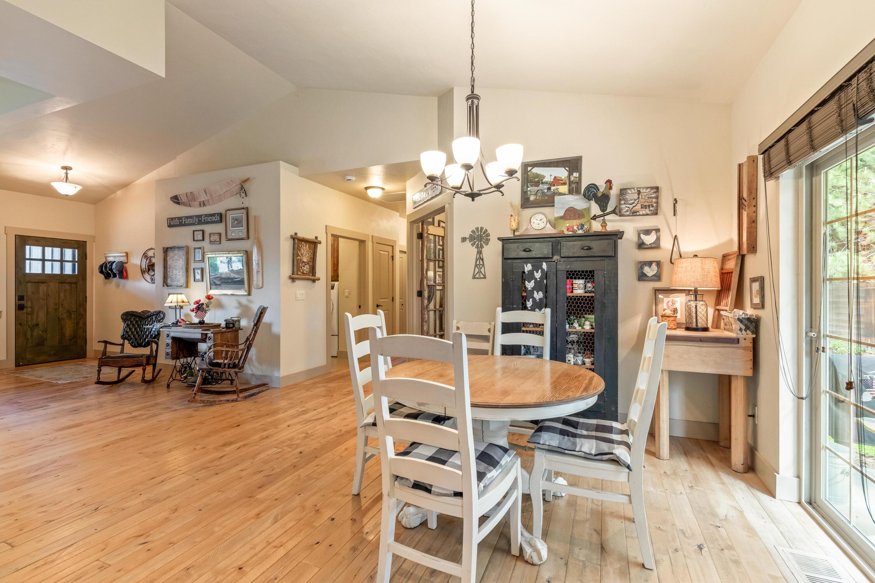 210 Northwest Saddle Ridge Loop Prineville, OR 97754 - Photo 12 of 38 a view of a dining room with furniture and a chandelier