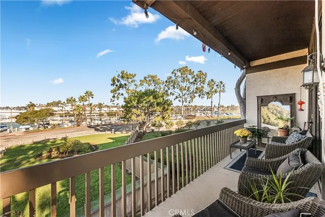 a view of a balcony with wooden floor