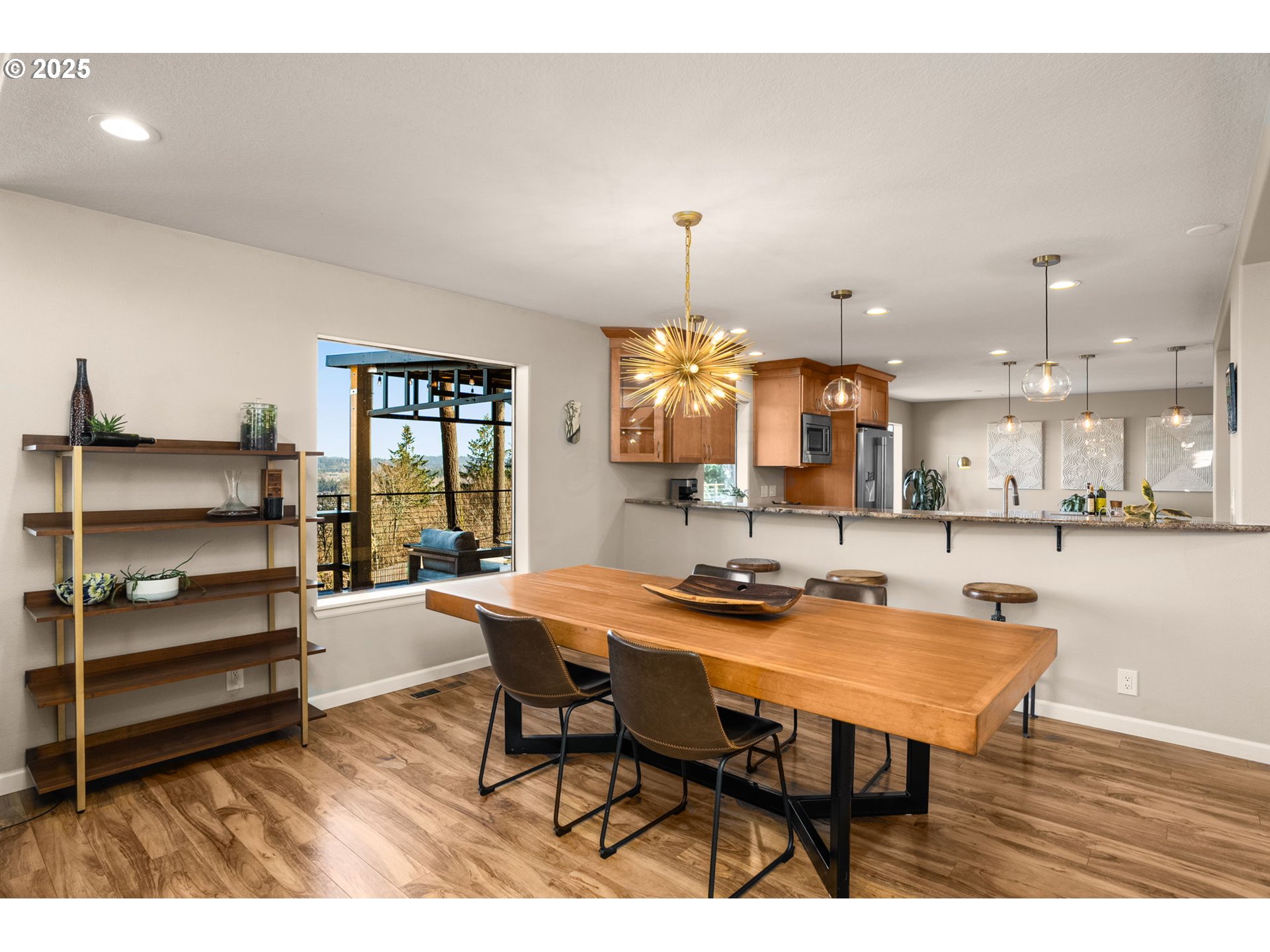 17287 South Overlook Road Oregon City, OR 97045 - Photo 11 of 48 a view of a dining room with furniture and wooden floor