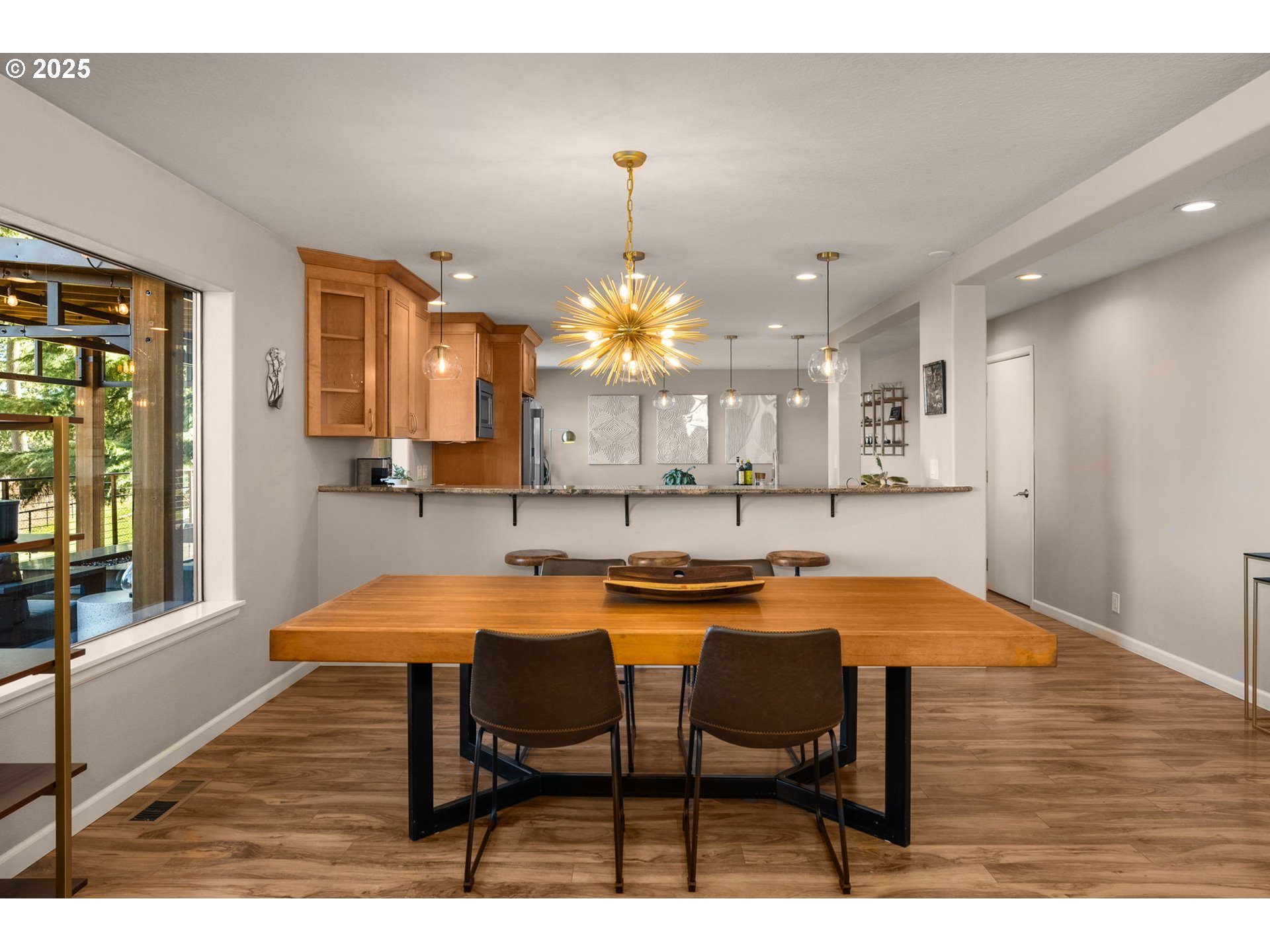 17287 South Overlook Road Oregon City, OR 97045 - Photo 12 of 48 a view of a dining room with furniture and a chandelier
