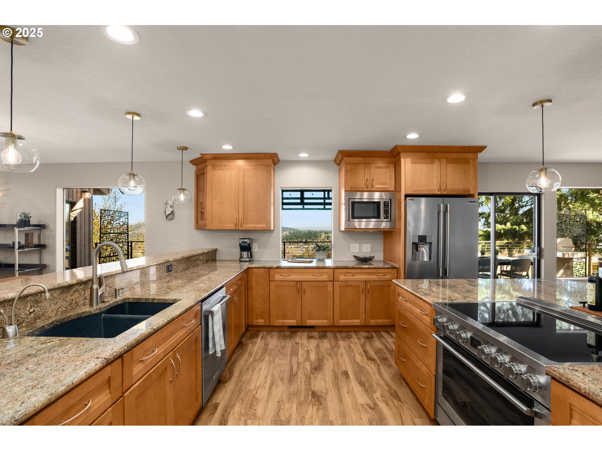 17287 South Overlook Road Oregon City, OR 97045 - Photo 16 of 48 a kitchen with stainless steel appliances granite countertop a sink stove and refrigerator