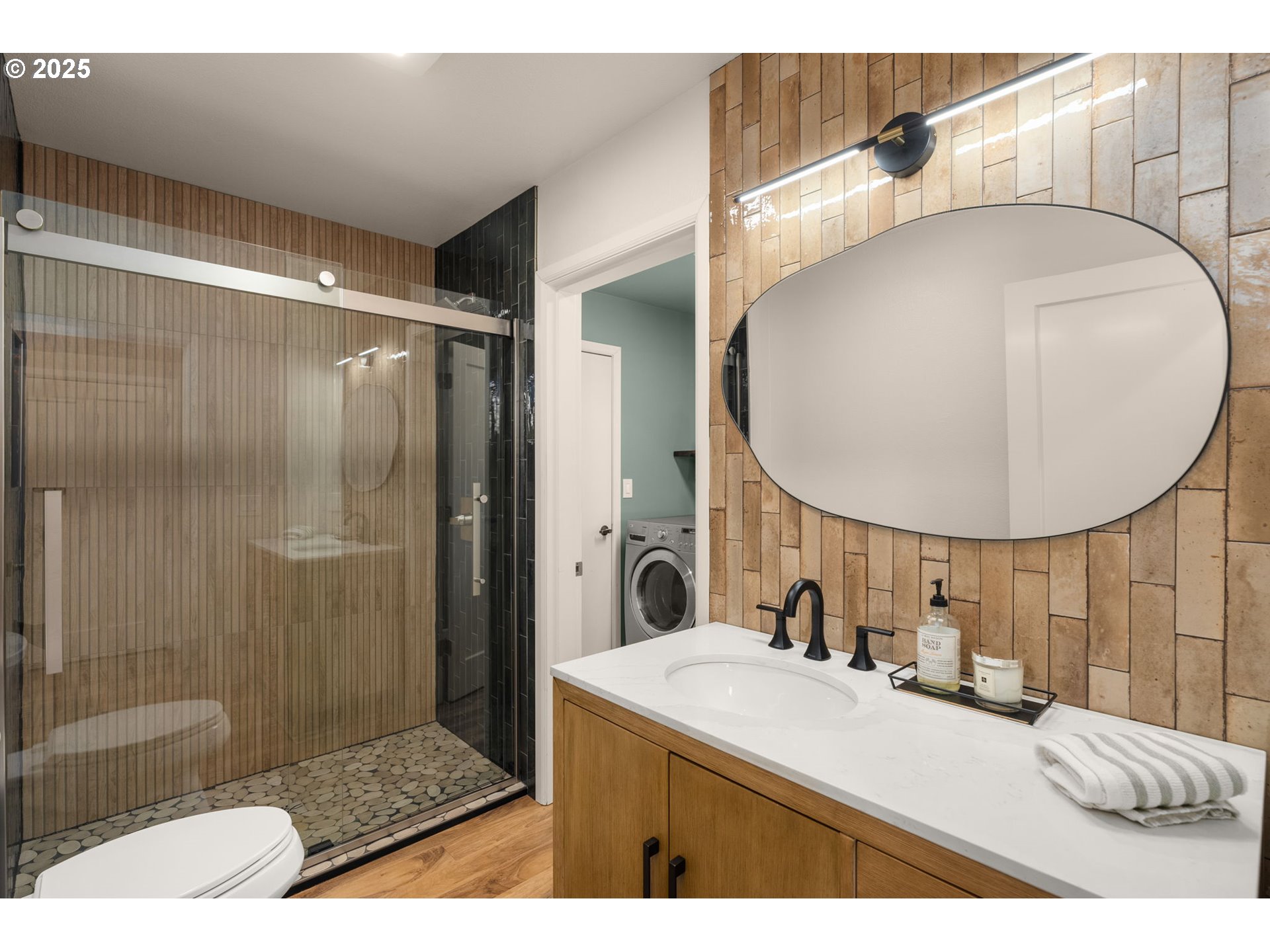 17287 South Overlook Road Oregon City, OR 97045 - Photo 21 of 48 a bathroom with a sink mirror and a shower