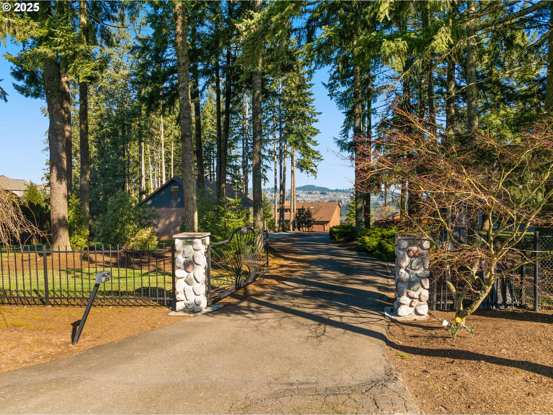 17287 South Overlook Road Oregon City, OR 97045 - Photo 47 of 48 a view of a street with a bench and trees