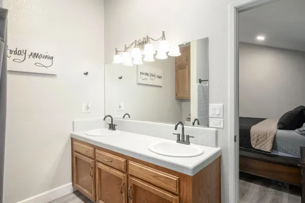 a bathroom with a sink and a mirror