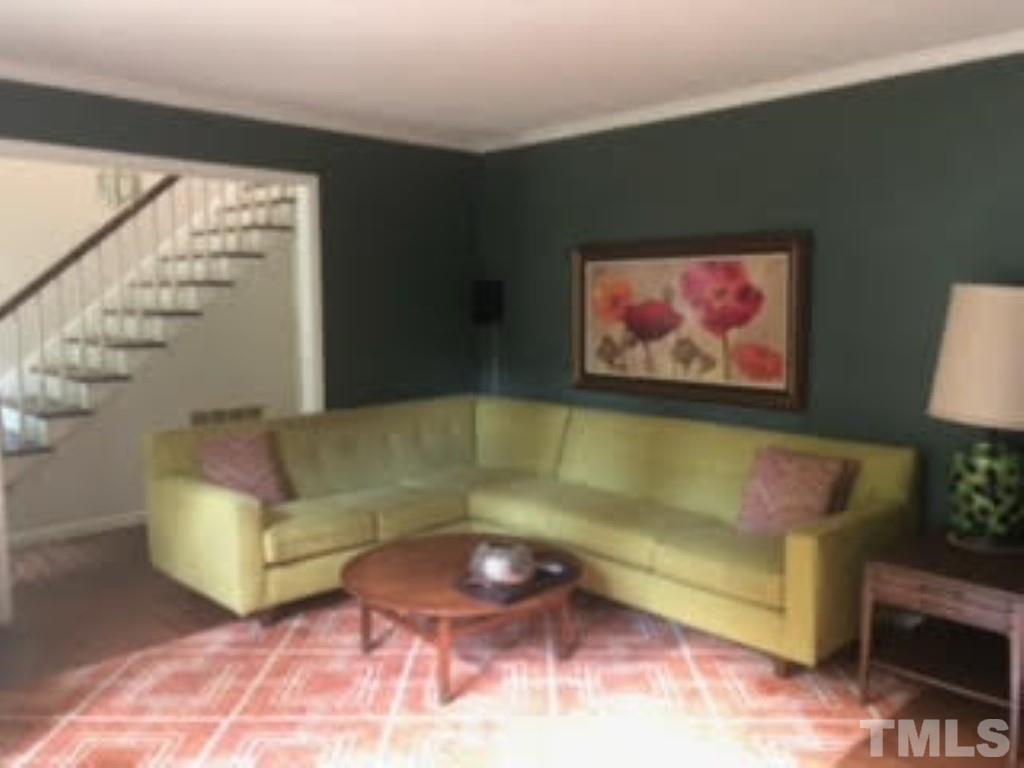 8709 Oneal Road Raleigh, NC 27613 - Photo 2 of 20 a living room with furniture and a large window