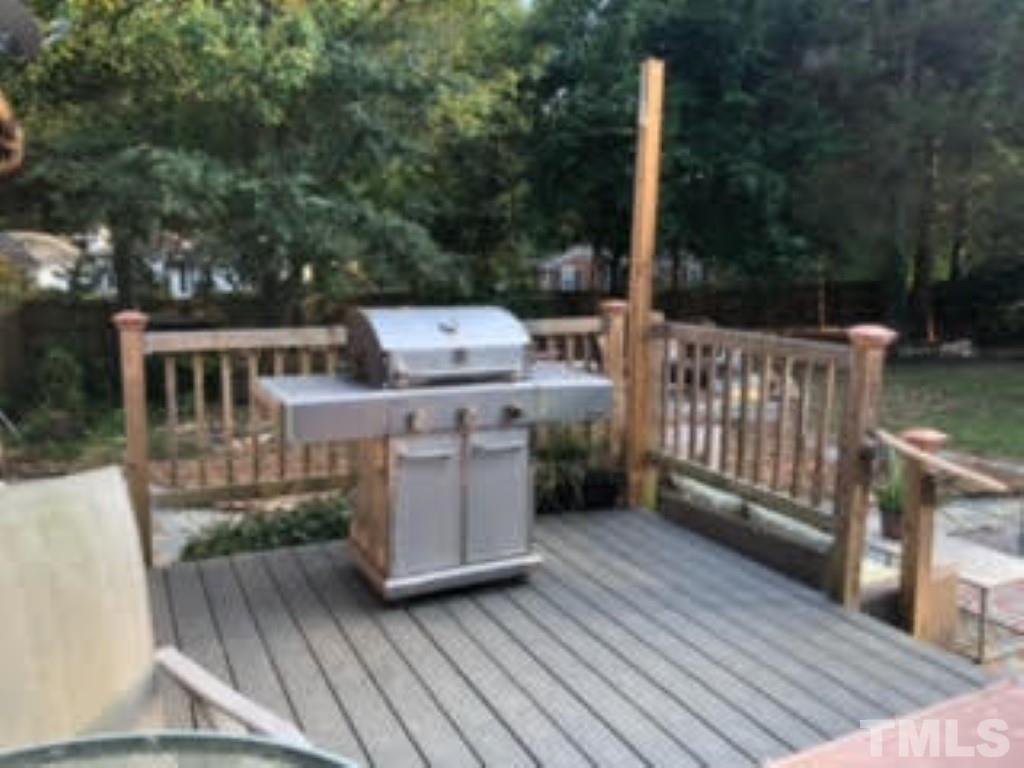 8709 Oneal Road Raleigh, NC 27613 - Photo 18 of 20 a view of a deck with wooden floor and fence
