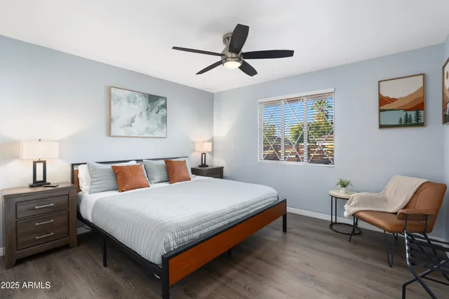 a bed room with a bed and a chair