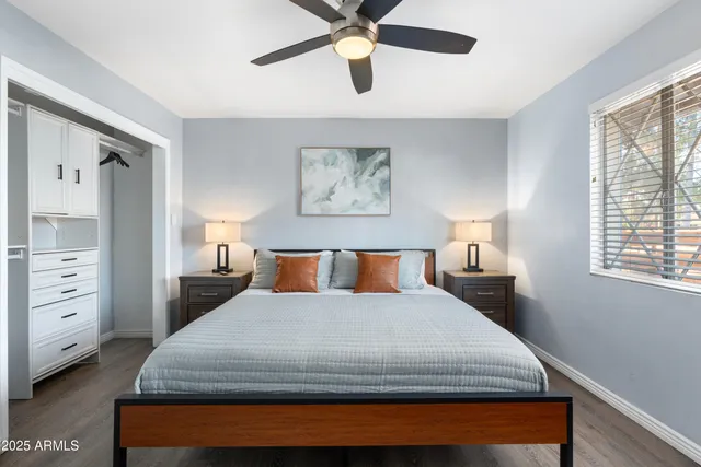 a bedroom with a bed and window