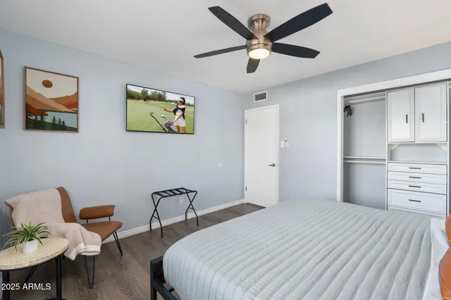 front view of a house with a large tree