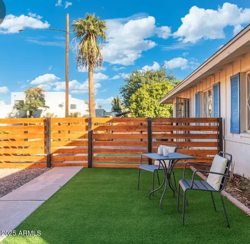 a kitchen with stainless steel appliances kitchen island granite countertop a sink a stove and cabinets