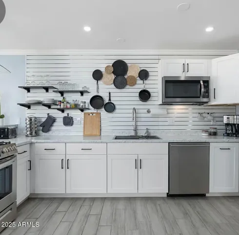 a living room with furniture a ceiling fan and a window