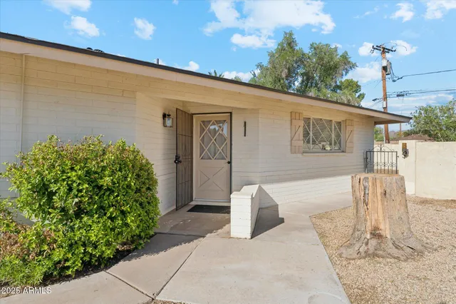 a kitchen with granite countertop a sink stainless steel appliances and cabinets