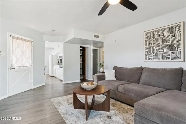 a view of a patio with table and chairs and potted plants