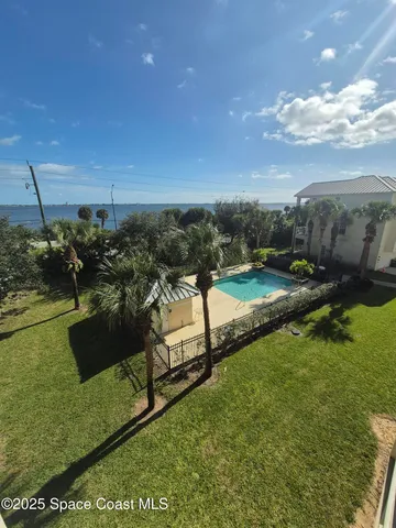 a view of a lake with a yard