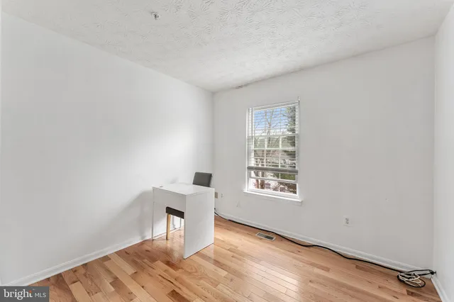 a workspace with wooden floor