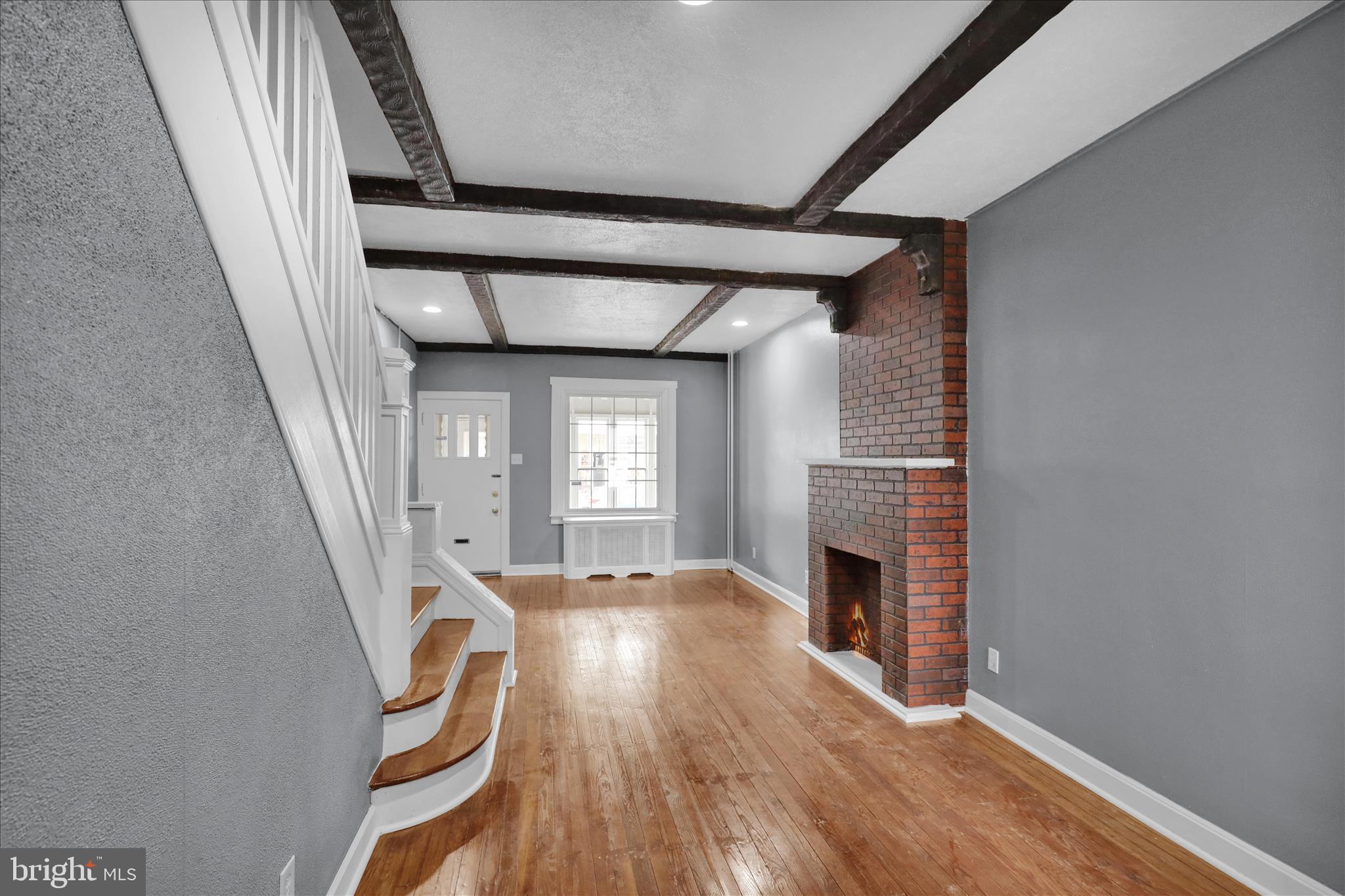 1409 Church Street Reading, PA 19601 - Photo 11 of 23 a view of a livingroom with wooden floor and fireplace
