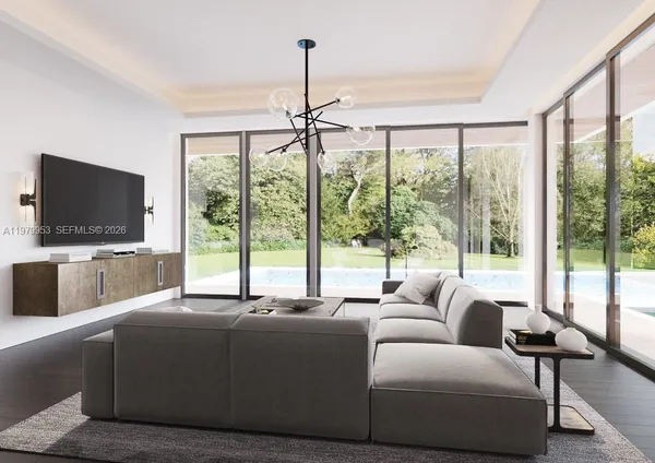 a living room with furniture and a flat screen tv
