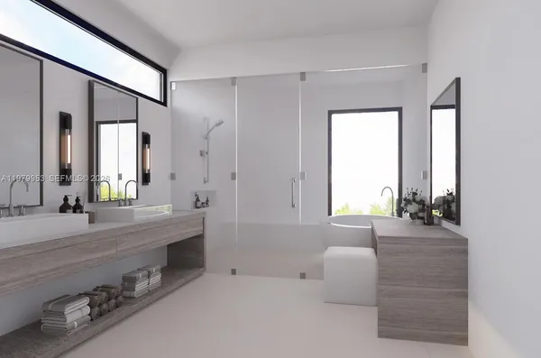a bathroom with a double vanity sink and a bathtub
