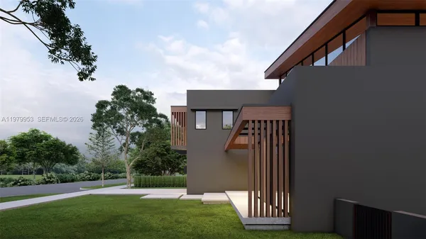 a view of a house with a backyard