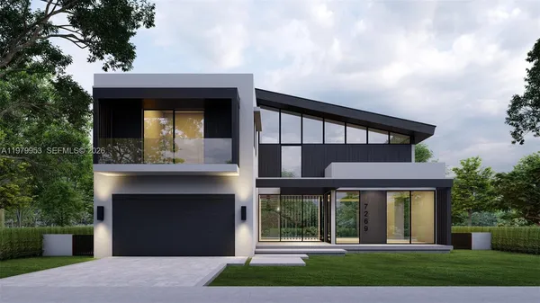 a front view of a house with a garden and garage