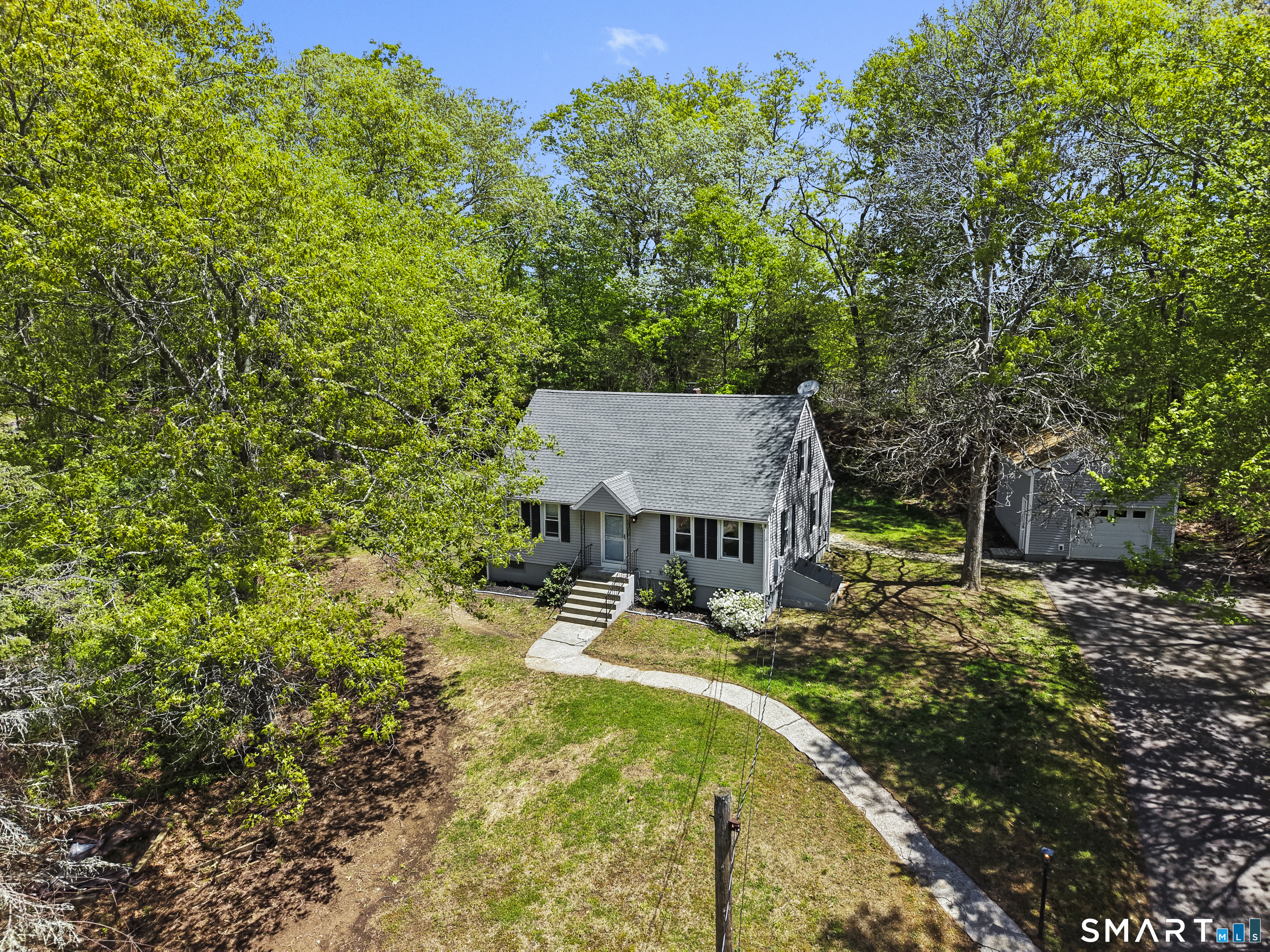 14 Church Street Sprague, CT 06330 - Photo 5 of 36 a view of a house with a yard and sitting area