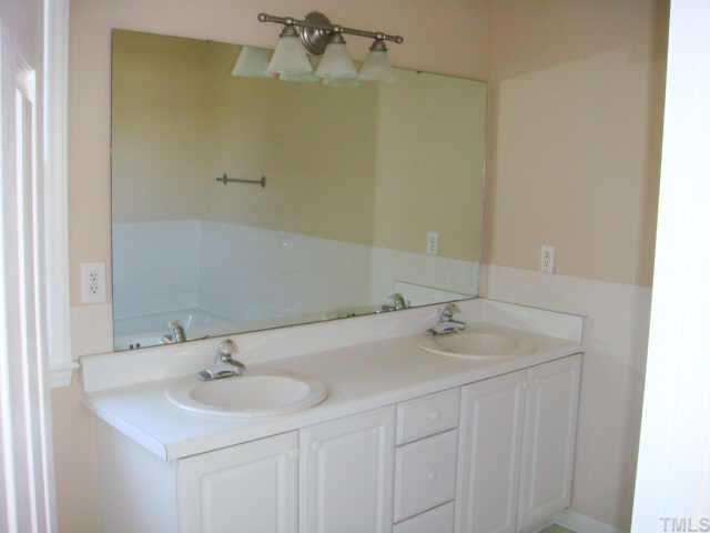 5905 Forest Ridge Drive Durham, NC 27713 - Photo 12 of 12 The master vanity has double sinks and plenty of drawer space.