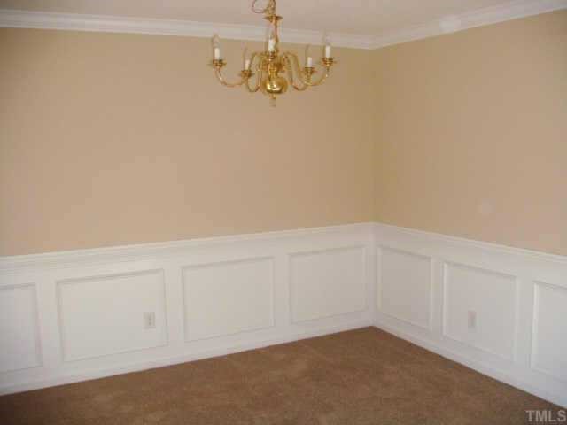 5905 Forest Ridge Drive Durham, NC 27713 - Photo 3 of 12 Dining room features wainscoating, crown molding, fresh paint & new carpet.