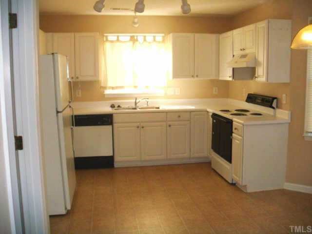 5905 Forest Ridge Drive Durham, NC 27713 - Photo 4 of 12 Large kitchen with lots of cabinets! Pull outs, track lighting, new vinyl and paint! Refrigerator conveys!