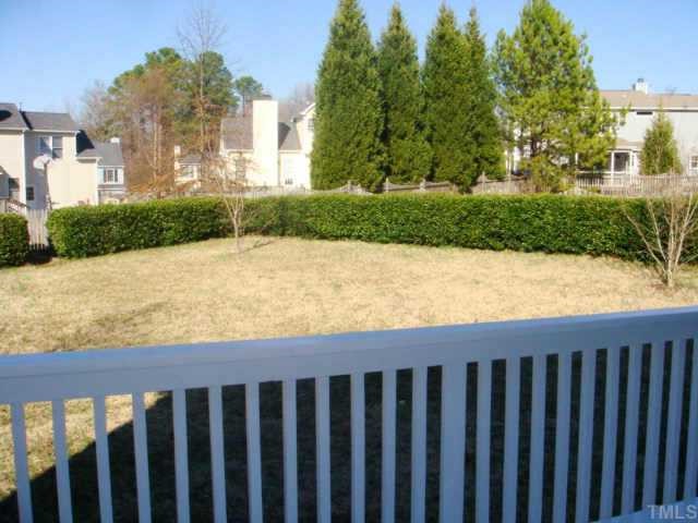 5905 Forest Ridge Drive Durham, NC 27713 - Photo 10 of 12 The backyard is large, flat and surrounded by a natural hedge.