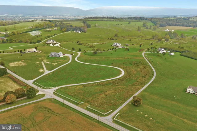 a view of a pool water and mountain view