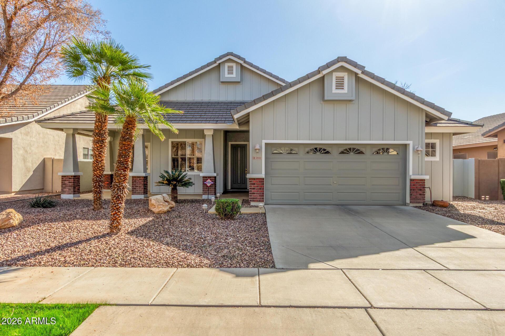 3553 East Washington Avenue Gilbert, AZ 85234 - Photo 1 of 30 a front view of a house with garden