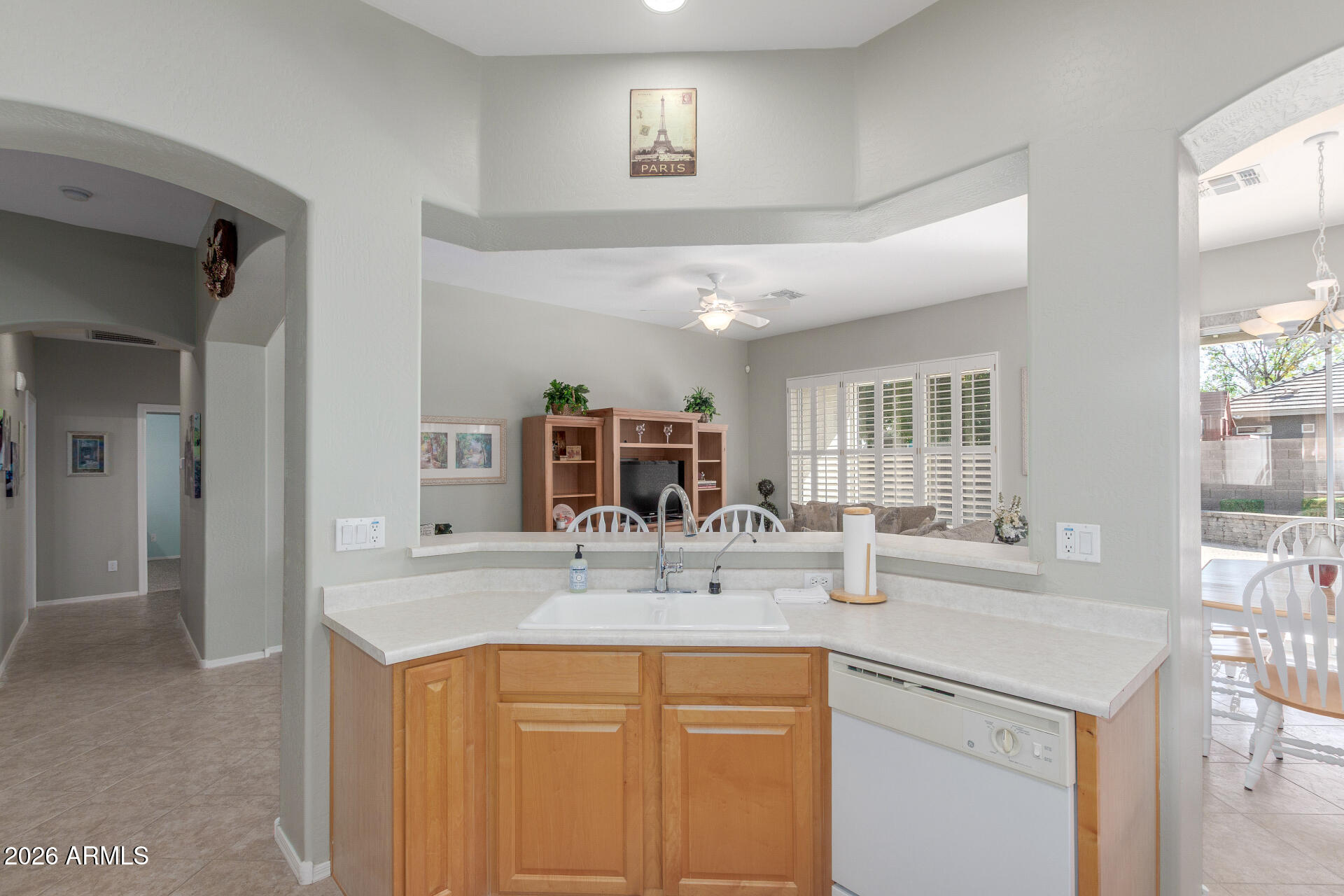 3553 East Washington Avenue Gilbert, AZ 85234 - Photo 13 of 30 a kitchen with granite countertop a sink and cabinets