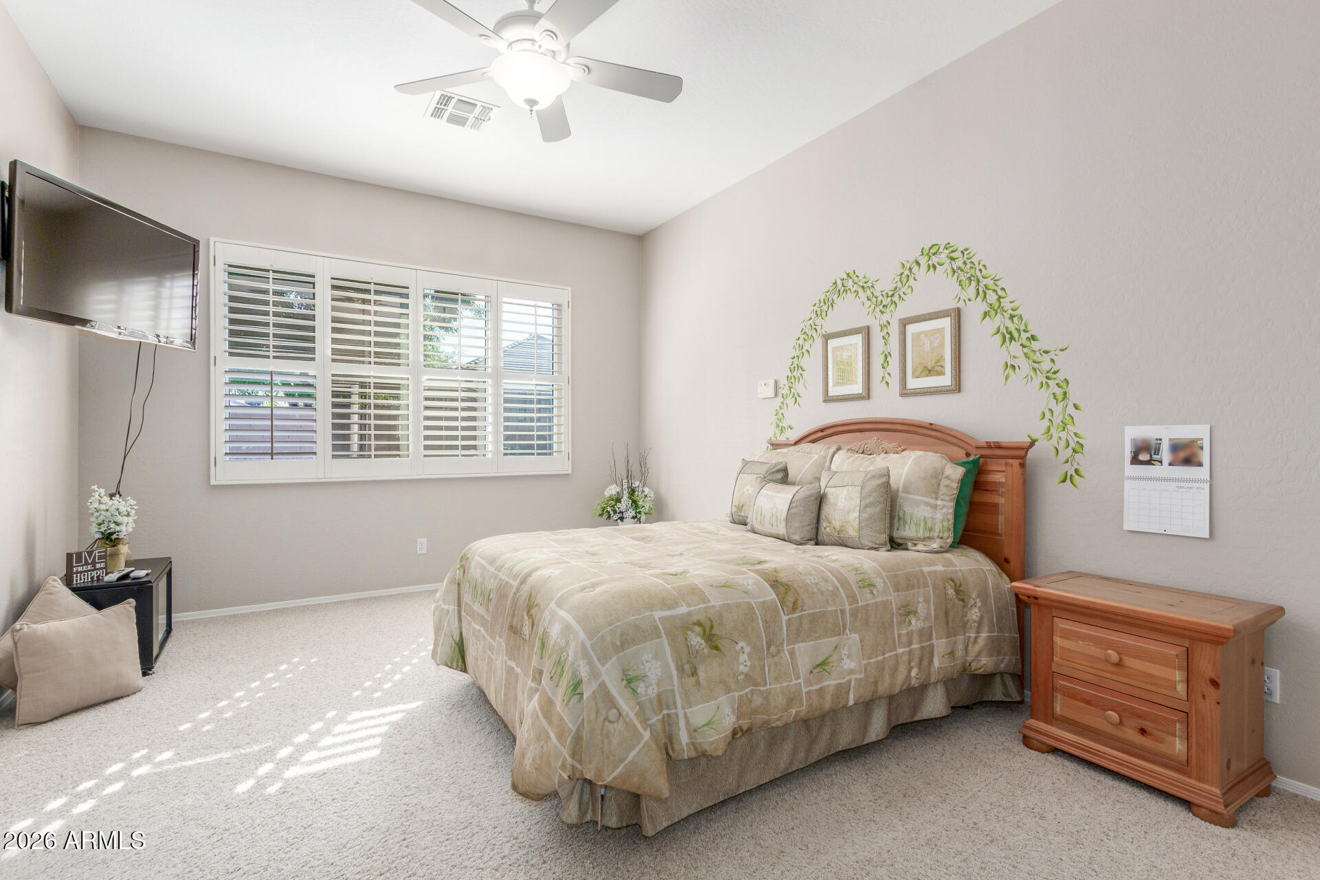 3553 East Washington Avenue Gilbert, AZ 85234 - Photo 14 of 30 a bedroom with a bed and a chandelier