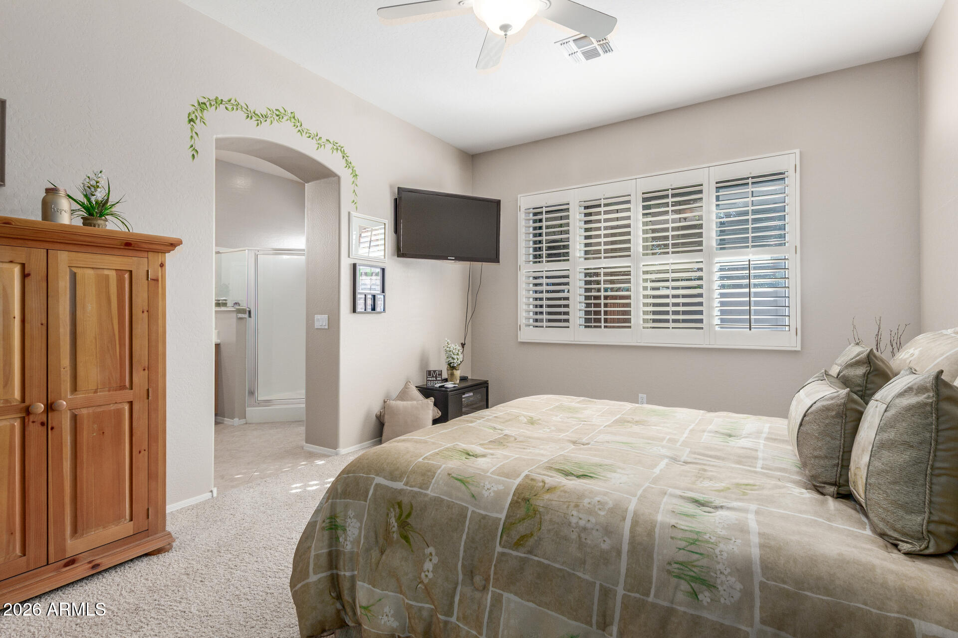 3553 East Washington Avenue Gilbert, AZ 85234 - Photo 15 of 30 a bedroom with a large bed and a window