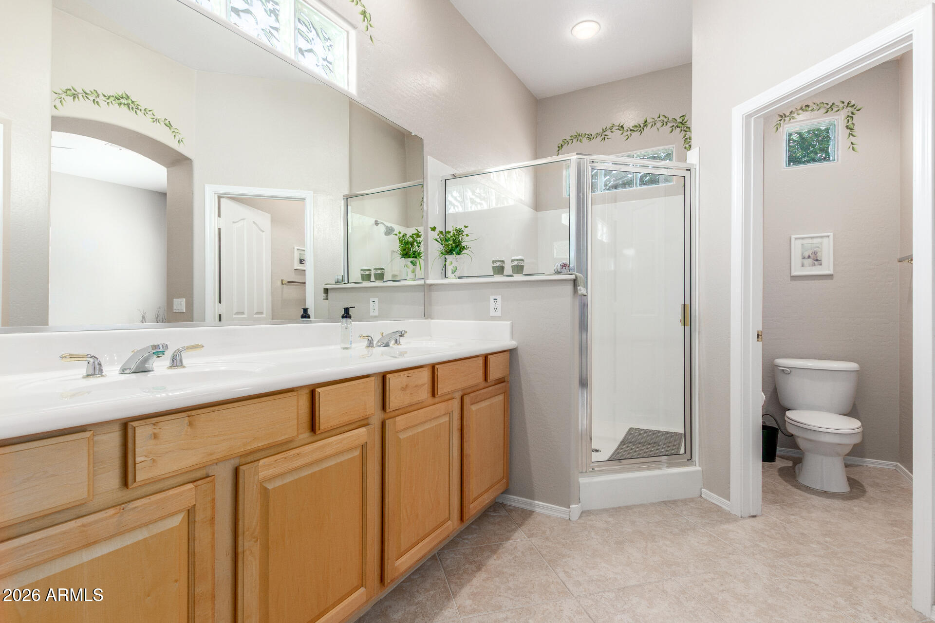 3553 East Washington Avenue Gilbert, AZ 85234 - Photo 18 of 30 a spacious bathroom with a double vanity sink toilet and shower
