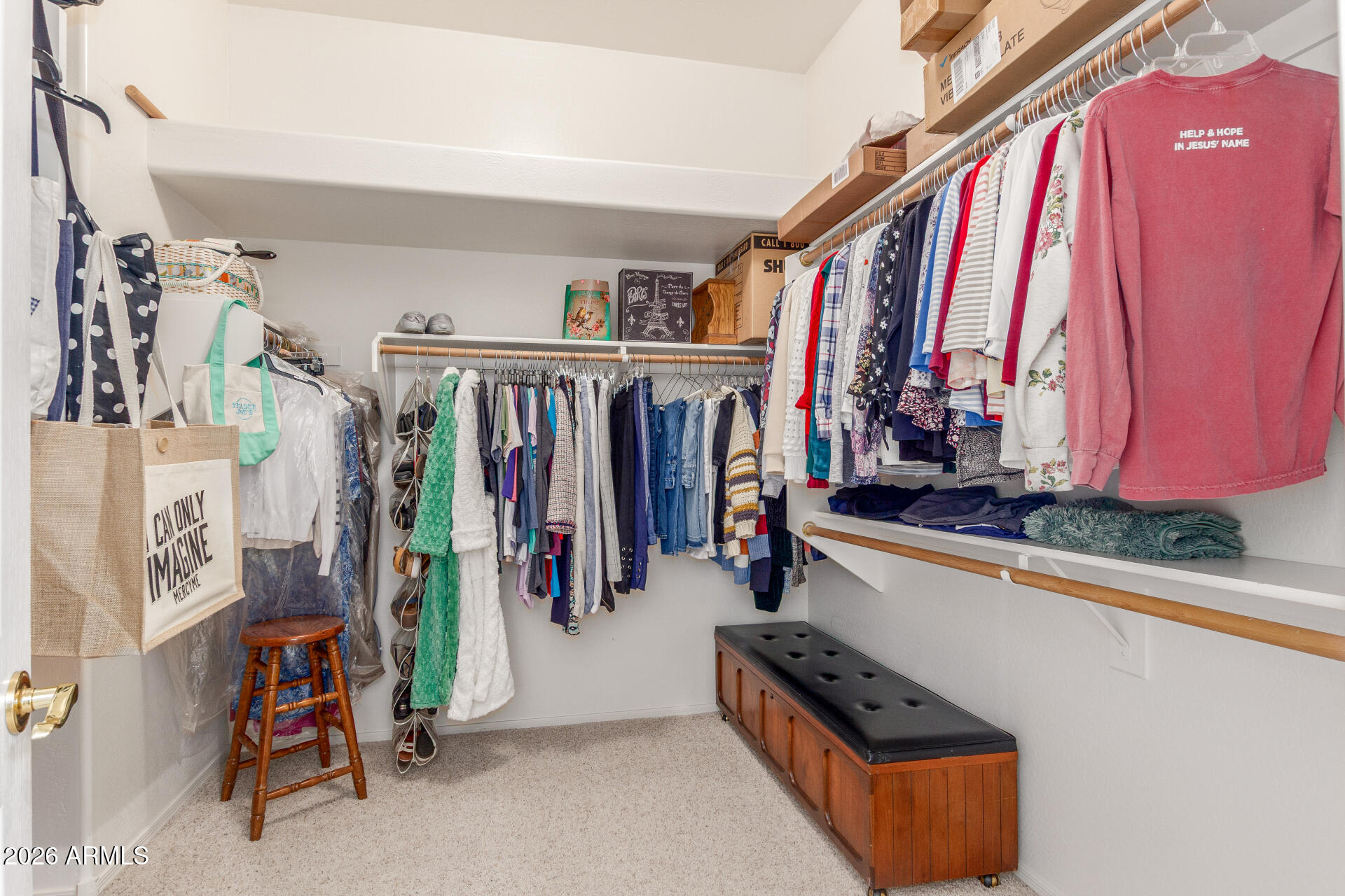 3553 East Washington Avenue Gilbert, AZ 85234 - Photo 19 of 30 a view of walk in closet with clothes and shoes