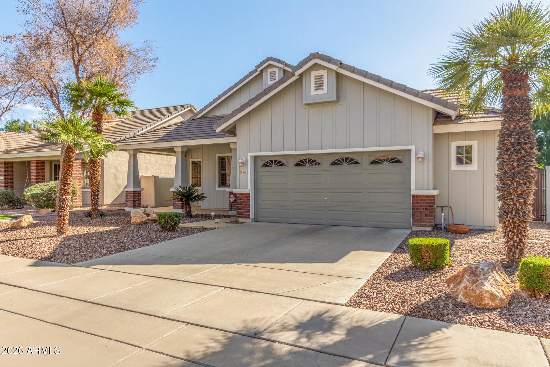 3553 East Washington Avenue Gilbert, AZ 85234 - Photo 2 of 30 a front view of a house with garden