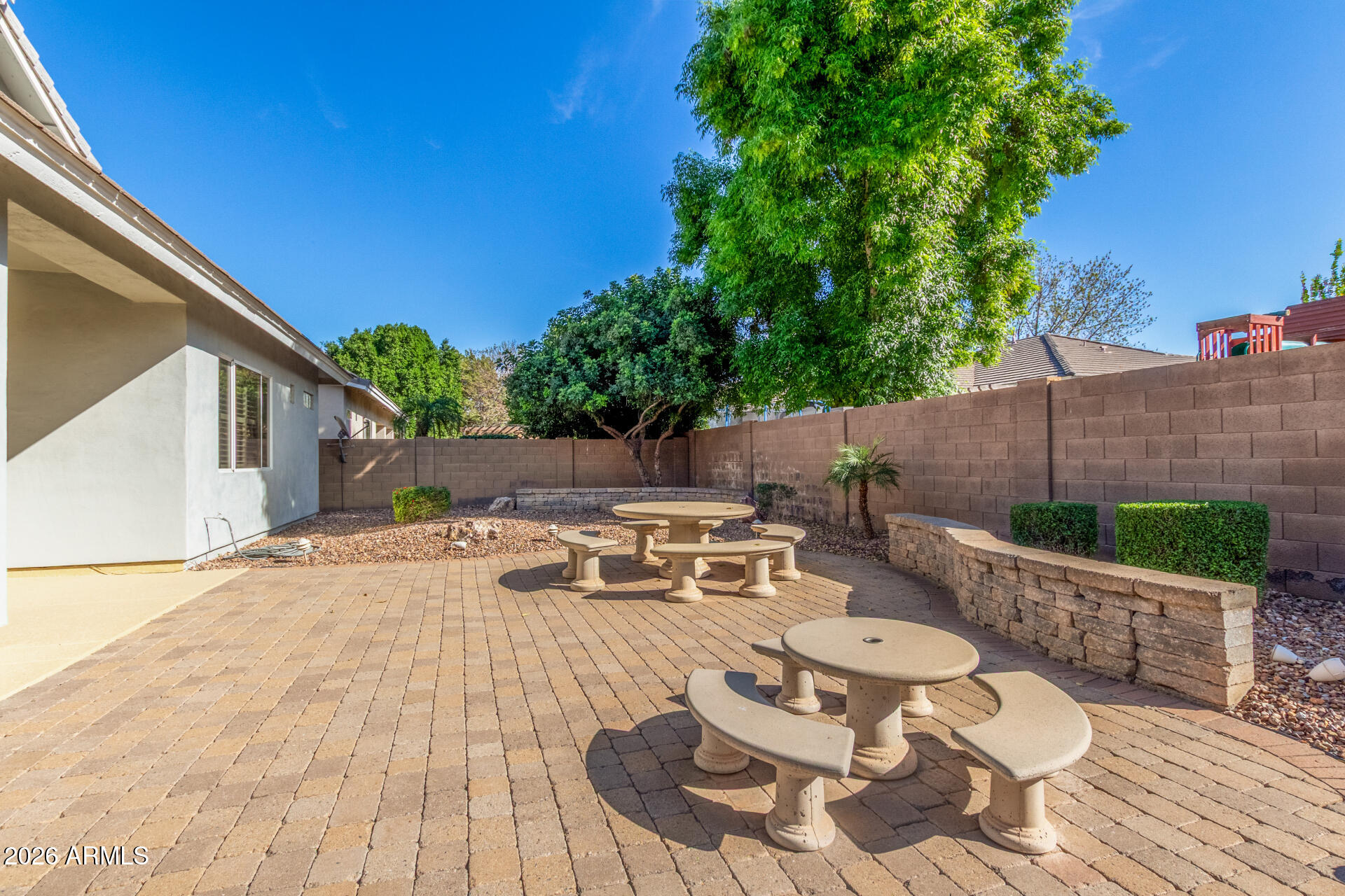 3553 East Washington Avenue Gilbert, AZ 85234 - Photo 27 of 30 a view of a patio with table and chairs potted plants with wooden floor