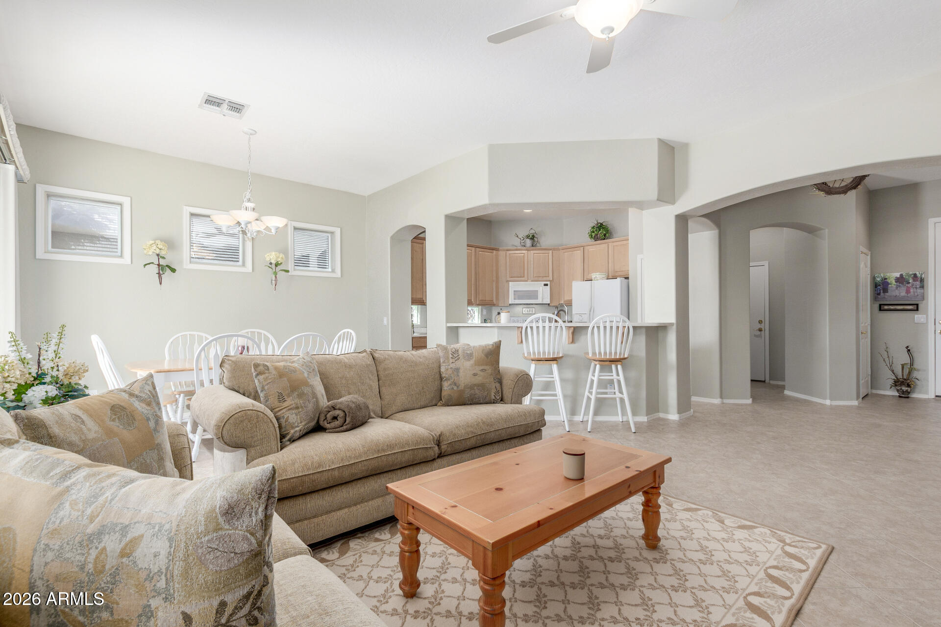 3553 East Washington Avenue Gilbert, AZ 85234 - Photo 7 of 30 a living room with furniture and a table