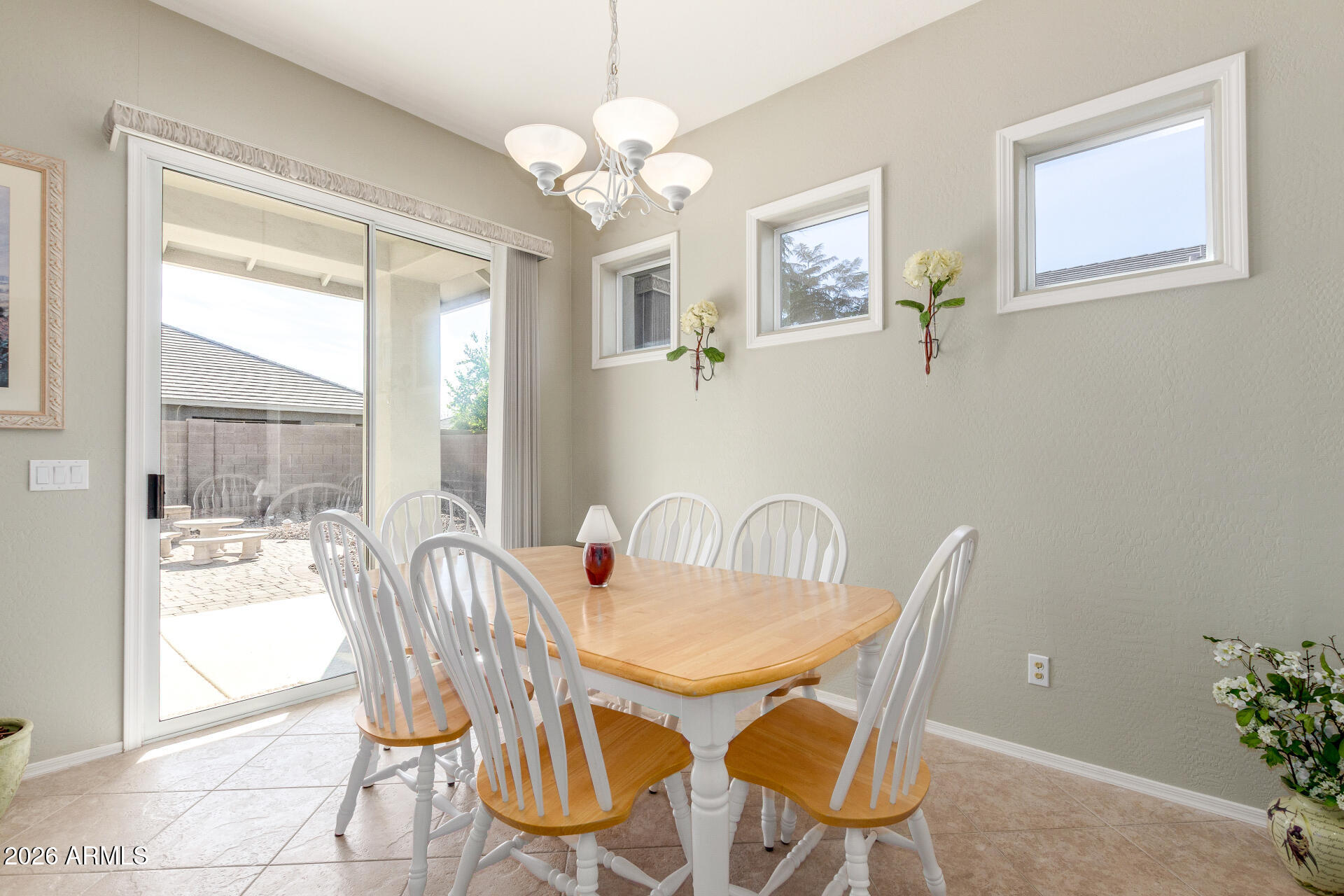 3553 East Washington Avenue Gilbert, AZ 85234 - Photo 9 of 30 a dining room with furniture and window
