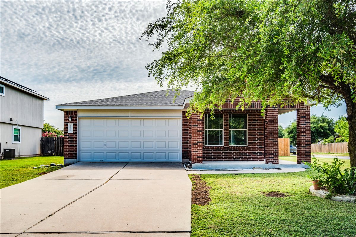 100 Easy Street Hutto, TX 78634 - Photo 1 of 36 A classic brick exterior with an attached garage offers inviting curb appeal.