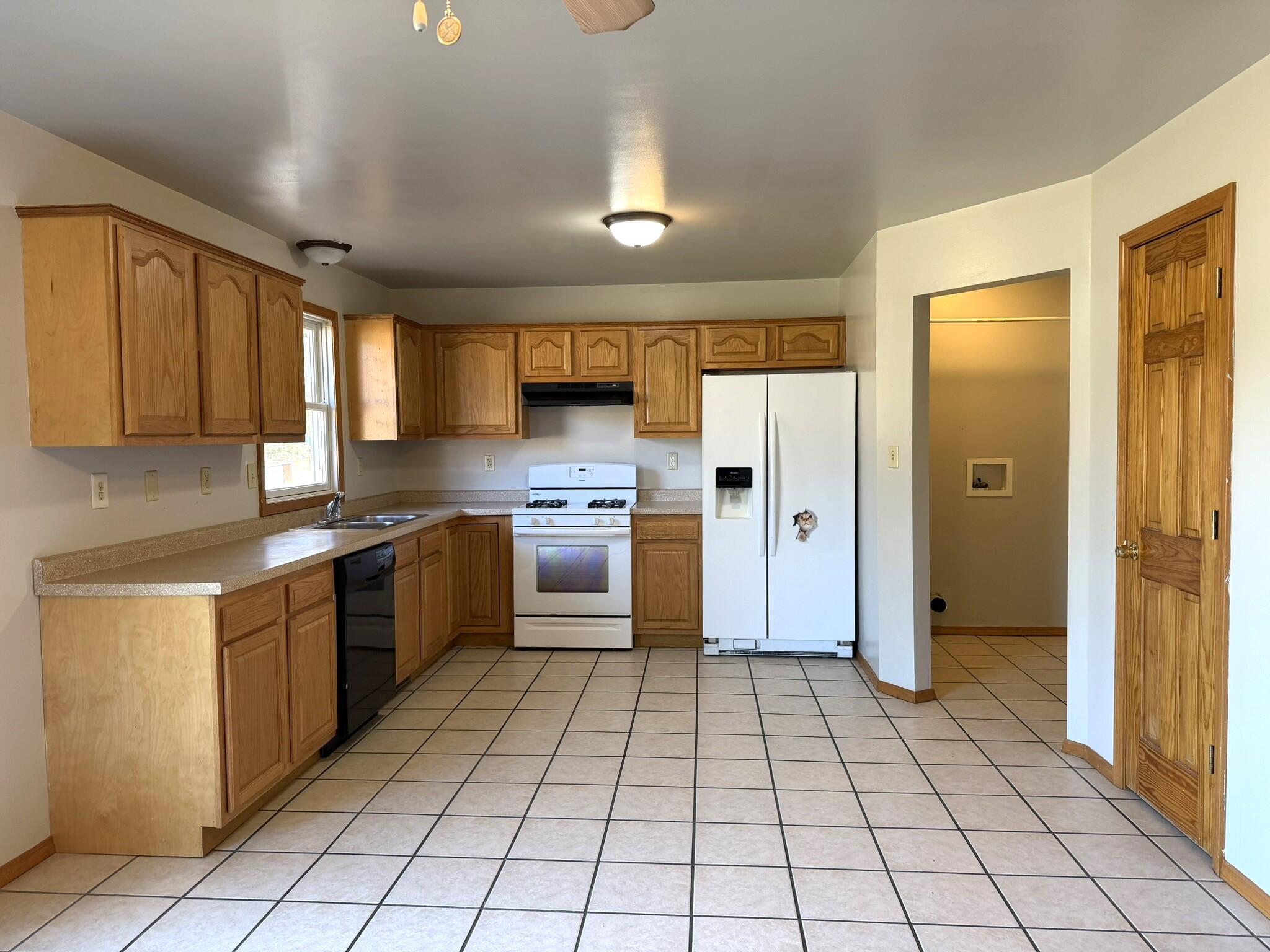 9103 Estates Drive Demotte, IN 46310 - Photo 17 of 35 a kitchen with stainless steel appliances granite countertop a refrigerator and a stove top oven