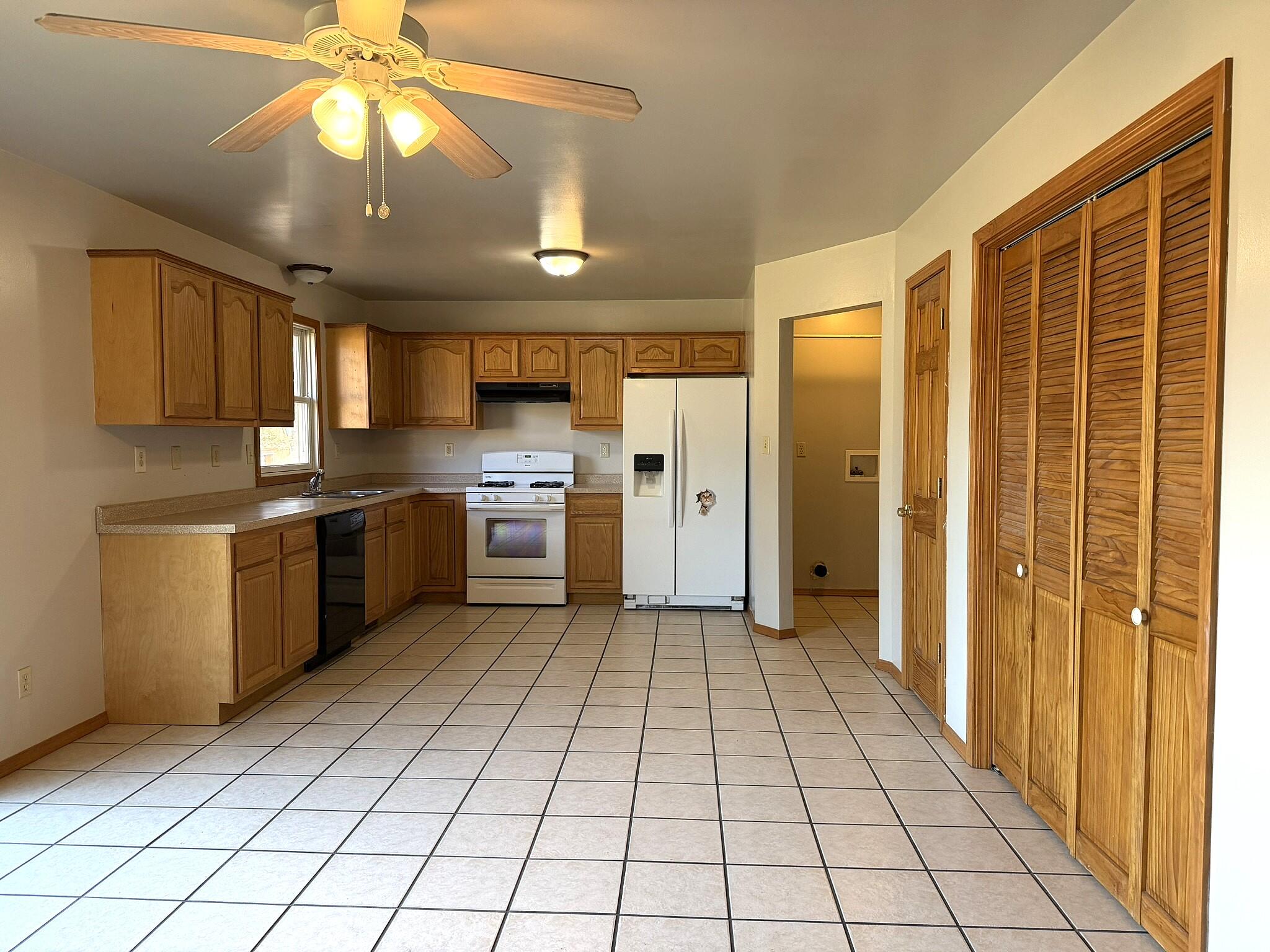 9103 Estates Drive Demotte, IN 46310 - Photo 18 of 35 a kitchen with stainless steel appliances granite countertop a refrigerator and a sink