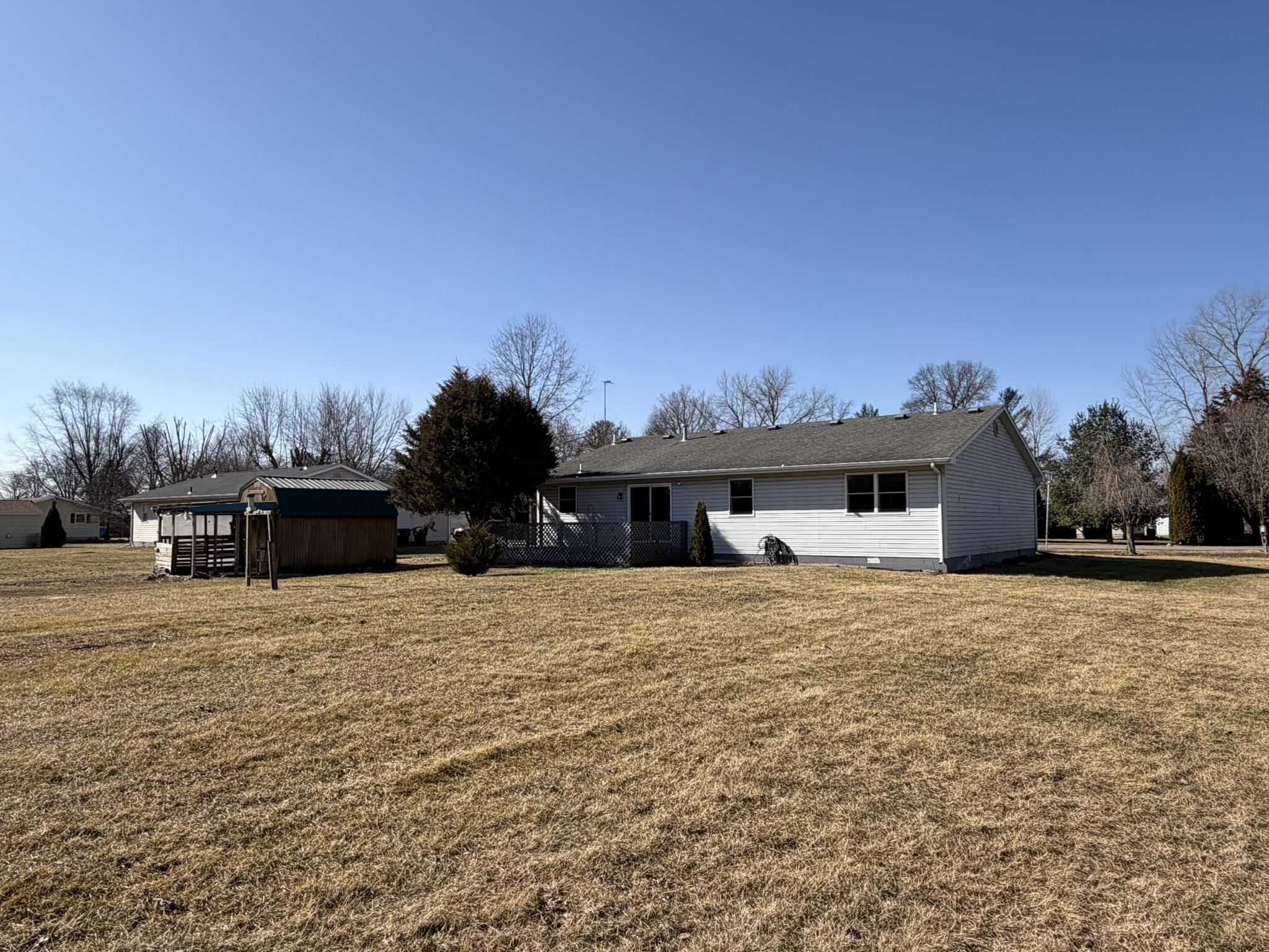 9103 Estates Drive Demotte, IN 46310 - Photo 7 of 35 a front view of a house with a yard and garage