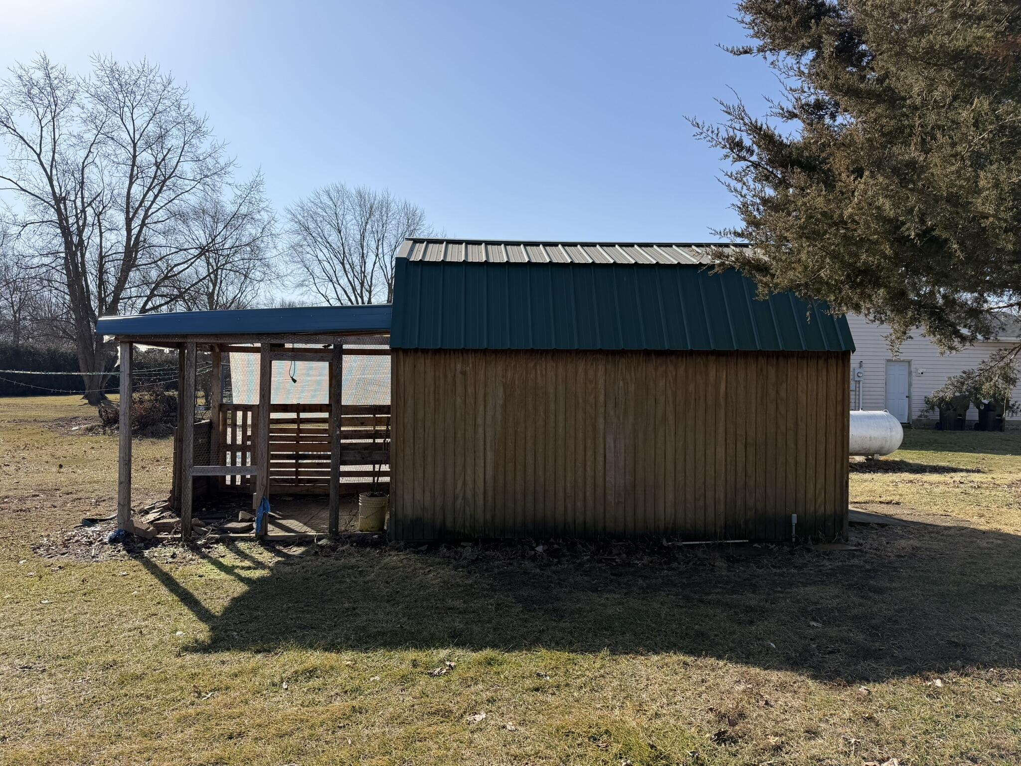 9103 Estates Drive Demotte, IN 46310 - Photo 10 of 35 a view of a backyard with wooden fence