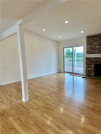 a large kitchen with stainless steel appliances granite countertop a refrigerator and a stove top oven