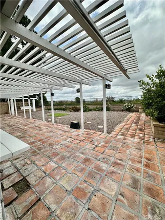 a view of a patio with table and chairs