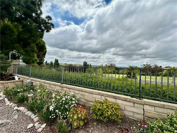 a view of a garden with a fountain