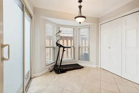 a view of an empty room with glass door