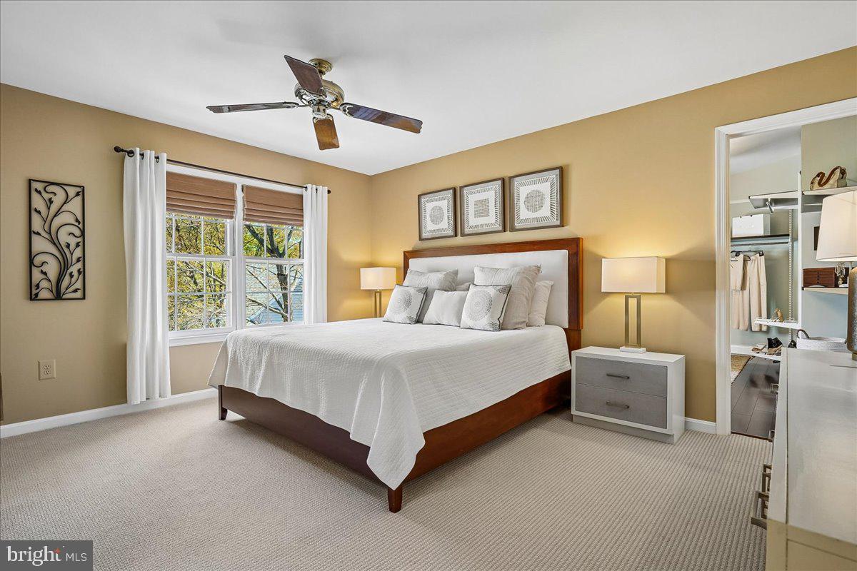 7801 Blue Jasmine Court Springfield, VA 22153 - Photo 23 of 61 a spacious bedroom with a bed and a window